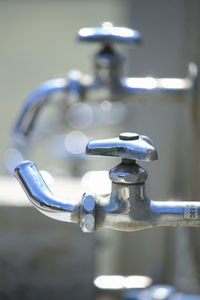 Close-up of faucet in water