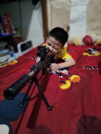 Portrait of boy with sniper rifles aim at the enemy - sniper picture