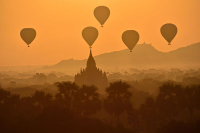 Hot air balloons against sky during sunset, bagan myanmar