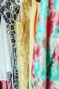 Close-up of clothes hanging on display at store