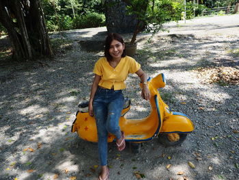 Portrait of smiling young woman outdoors