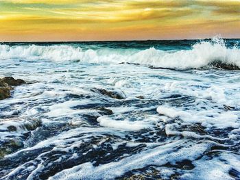 Scenic view of sea at sunset