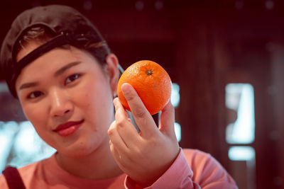 Portrait of boy holding apple