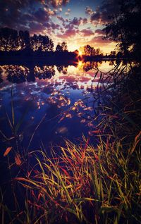 Scenic view of lake at sunset