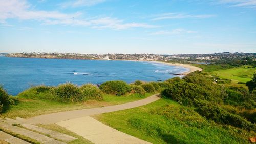 Scenic view of landscape against blue sky