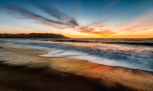 Scenic view of sea against sky during sunset