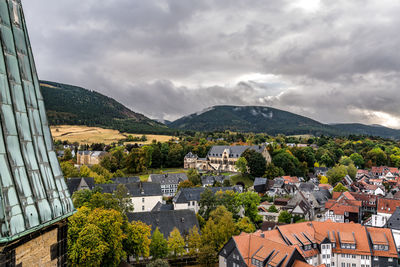 High angle view of townscape and mountains against sky