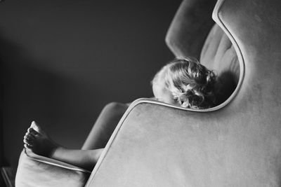 Toddler sitting in armchair