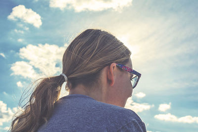 Low angle view of woman against sky