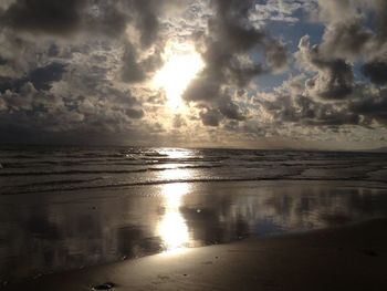 Scenic view of sea against cloudy sky