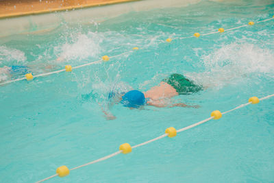 High angle view of person swimming in pool