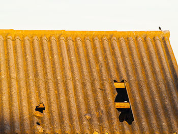 Yellow built structure against clear sky