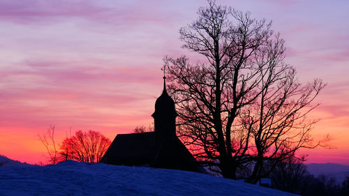 Silhouette tree against sky during winter