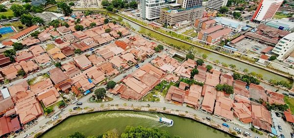 High angle view of river amidst buildings in city