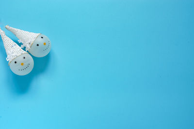 High angle view of balloon against blue background