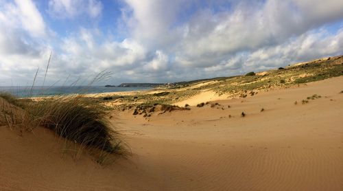 Scenic view of beach against sky
