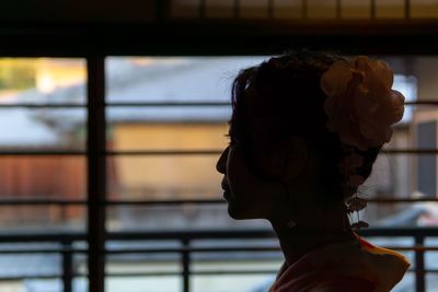 Close-up portrait of woman looking away