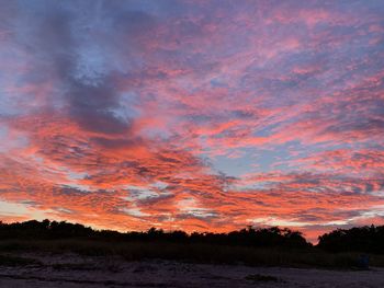 Scenic view of dramatic sky during sunset