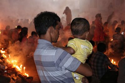 Rear view of man looking at music concert