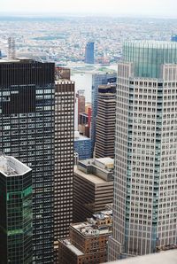 High angle view of buildings in city against sky
