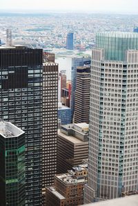 High angle view of buildings in city against sky