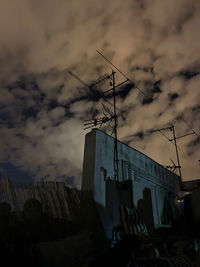 Low angle view of buildings against sky at dusk