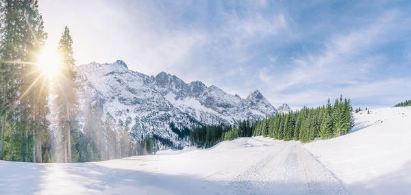 Scenic view of snow covered mountains against sky