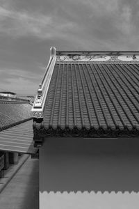 Low angle view of building against cloudy sky