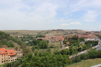 Scenic view of town against sky