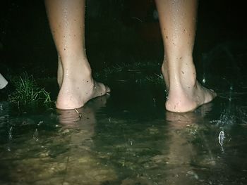 Low section of woman in water