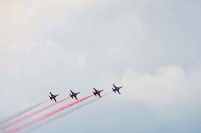 Low angle view of airplane against sky