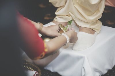 Midsection of woman holding bouquet