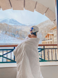 Skiing snowboarding girl in a mount hotel