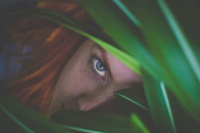 High angle portrait of young woman by plants