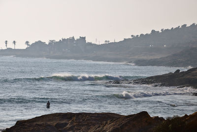 Scenic view of sea against clear sky