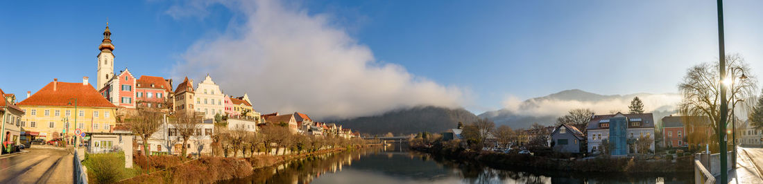 Panoramic view of canal amidst buildings in town