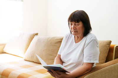 Young woman using laptop at home