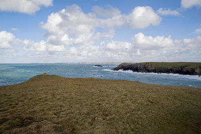 Scenic view of beach and sea against sky