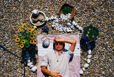 Low angle view of woman standing by plants