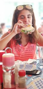 Portrait of woman eating food