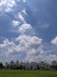 Houses in city against sky