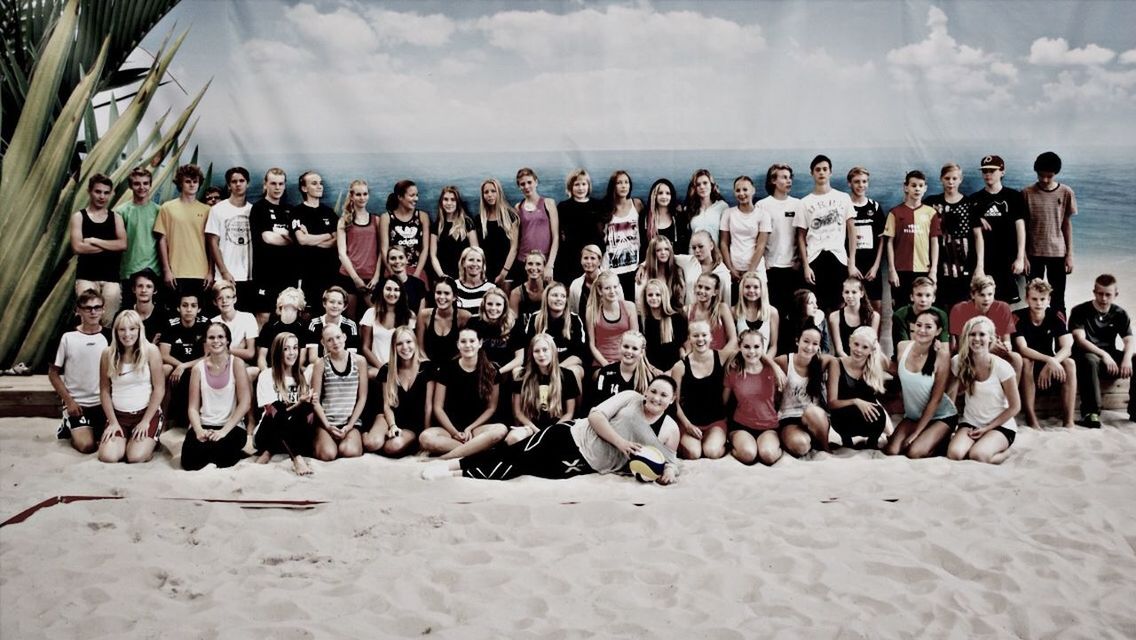 beach, sand, large group of people, sky, shore, person, men, vacations, cloud - sky, leisure activity, lifestyles, day, in a row, outdoors, sunlight, panoramic, tourism, travel, relaxation