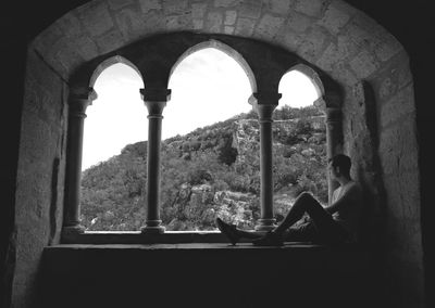 Man sitting in corridor