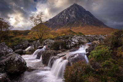 Scenic view of river flowing through rocks