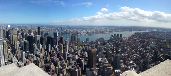 Cityscape against cloudy sky