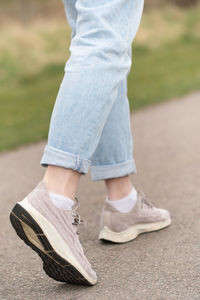 Closeup of legs of a woman walking outdoors