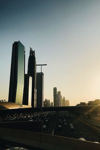 Modern buildings against clear sky during sunset