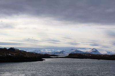 Scenic view of snowcapped mountains against sky during winter