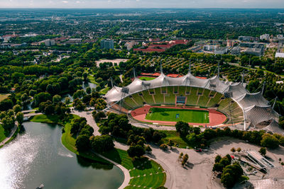 High angle view of olympic stadium by a lake in city of munich 