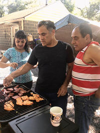 People standing by food